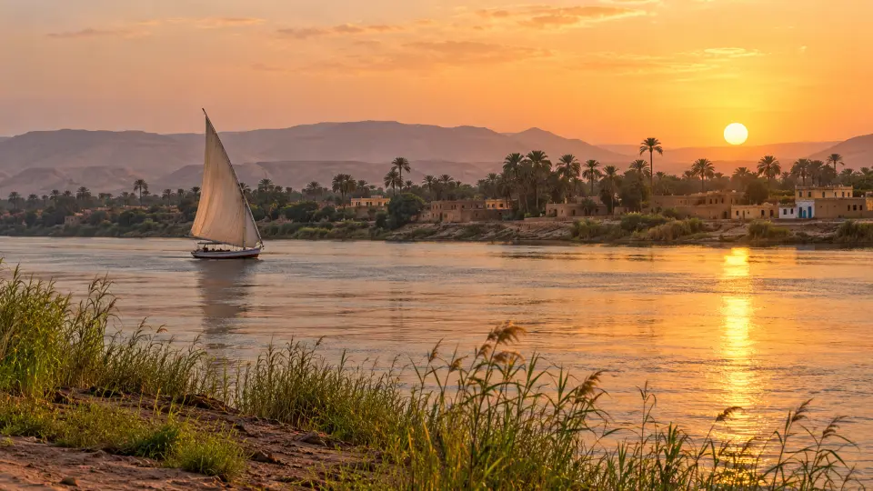 Felucca sailing on the Nile at sunset