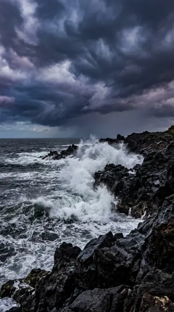 Stormy waves on volcanic rocks
