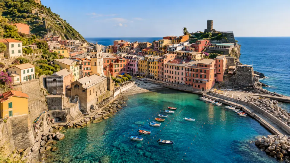 Colourful cliffside village above a harbour